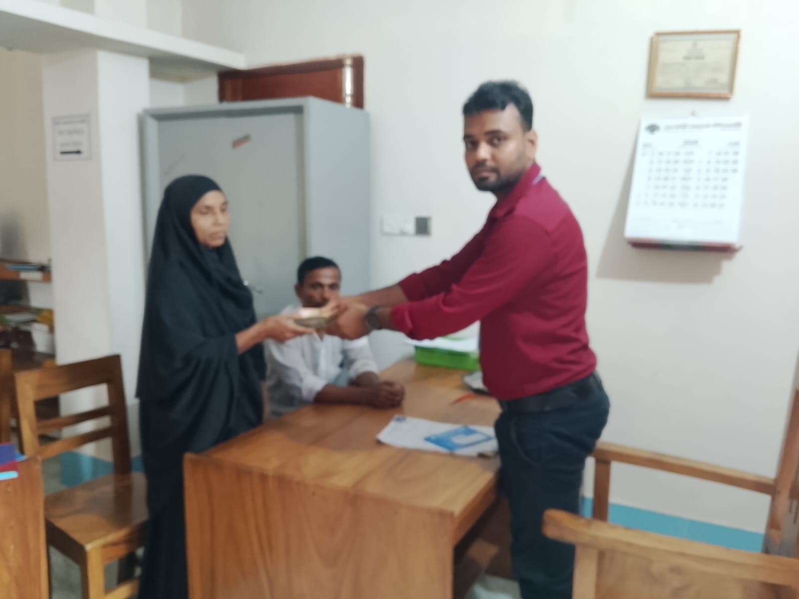 গ্রাহকের মাঝে ঋণ বিতরণ কার্যক্রম।